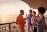 Friends enjoying drinks on a Celebrity Cruises